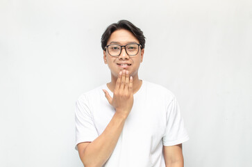 asian young students happily using sign language isolated against white background. Asian man...