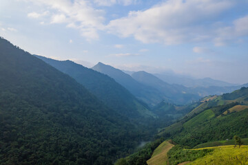 Aerial view of amazing mountain landscape colorful sunset over the cloudy sky.