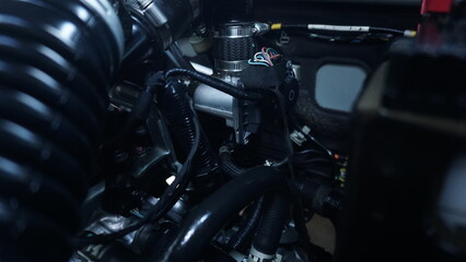 The car's engine compartment looks clean and tidy.