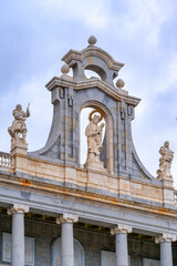 Sculptures of religious saints atop Almudena Cathedral, Madrid, Spain.