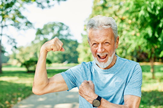 man muscle strength bicep  fitness senior strong arm muscular power training fit mature healthy body exercise confident macho motivation fun flexing