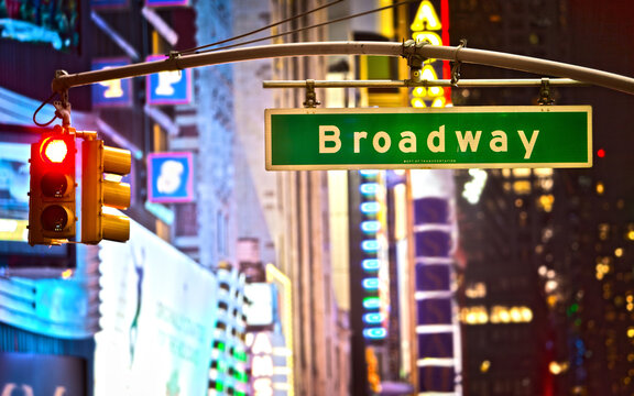 Broadway sign in New York City at night with neon lights