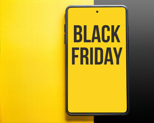 Smartphone displaying "BLACK FRIDAY" text on a vibrant yellow background
