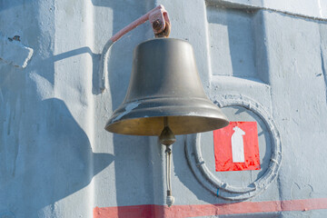Ship bell on board ferry. High quality photo