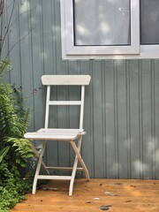 Minimalist Wooden Chair in a Serene Outdoor Corner