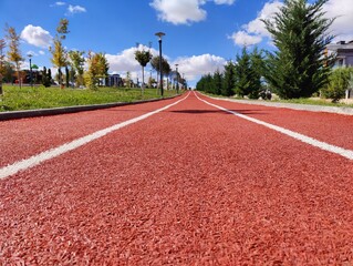 Path to Progress: A Running Track Leading Towards the Horizon, Representing Perseverance and the...