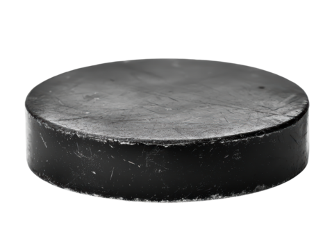 Black hockey puck on a white isolate background.