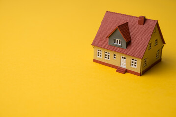 Dream house on yellow background copy space minimal style. Dream home, homebuyer, home finance, mortgage loan, money savings management for family built, construction industry and development concept.