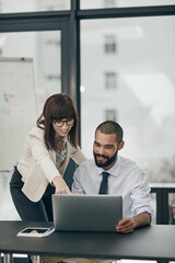 Business, people or laptop in office for help, feedback or advice with innovative accounting software. Woman, man or pointing at computer for finance management, research or budget review in company