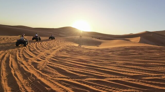 Quad Biking in the Moroccan Sahara Desert at sunrise 