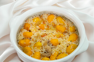 Traditional Brazilian dish chicken with pequi (caryocar brasiliense) and rice