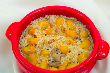 Traditional Brazilian dish chicken with pequi (caryocar brasiliense) and rice