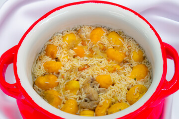 Traditional Brazilian dish chicken with pequi (caryocar brasiliense) and rice