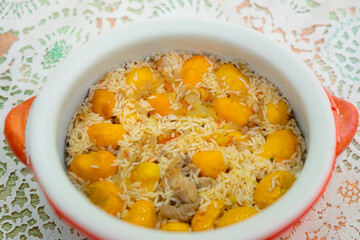 Traditional Brazilian dish chicken with pequi (caryocar brasiliense) and rice