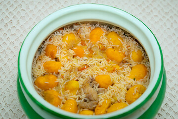 Traditional Brazilian dish chicken with pequi (caryocar brasiliense) and rice
