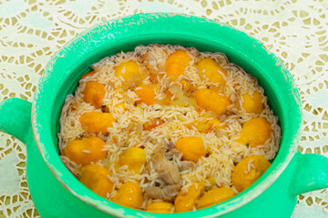 Traditional Brazilian dish chicken with pequi (caryocar brasiliense) and rice