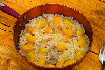 Traditional Brazilian dish chicken with pequi (caryocar brasiliense) and rice
