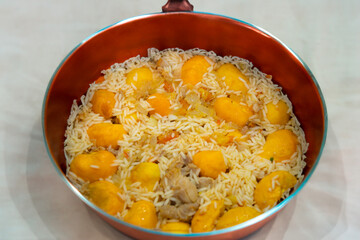 Traditional Brazilian dish chicken with pequi (caryocar brasiliense) and rice