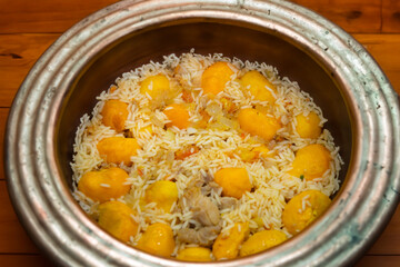 Traditional Brazilian dish chicken with pequi (caryocar brasiliense) and rice