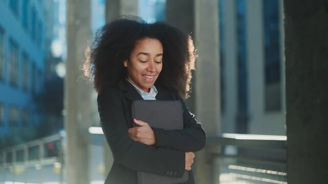 Inspired african american female take deep breath before the first day at new job work important interview or university outdoors Pretty young woman dares to take an important step at city street