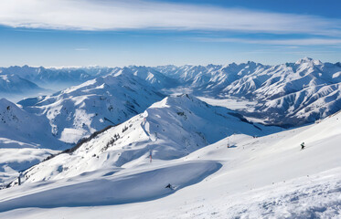 Panoramic view of winter mountains. Landscape of ski resort on a clear sunny day. Alpine mountains covered with white snow against blue sky. Winter holidays.