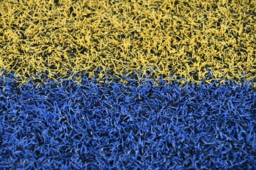 Yellow and Blue Artificial Turf on a Football Field