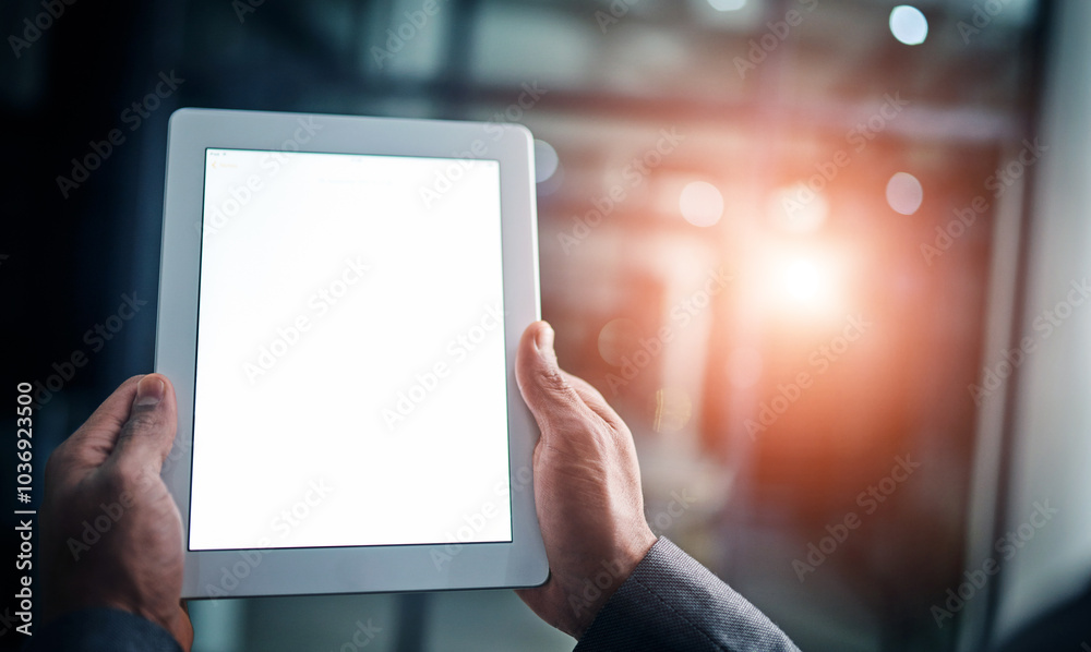 Poster Man holding tablet in hand with blank screen over a isolated copy space background. Closeup of businessman hands on a digital tablet in a modern office working late at night.