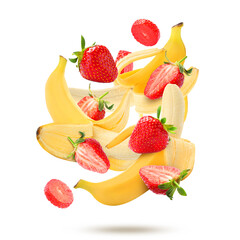 Fresh bananas and strawberries falling on white background