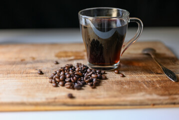 freshly brewed coffee on the table with coffee beans