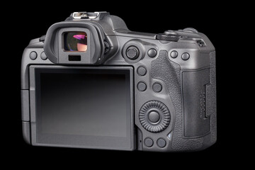 black 2020s professional 35mm full-frame mirrorless camera body with flip screen isolated on black background.