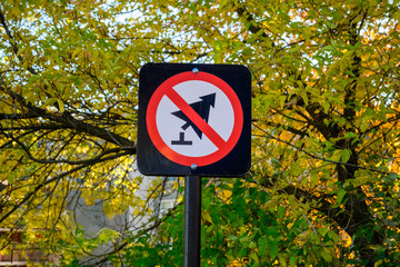 signage: no cutting trees sign on metal post in ottawa city park
