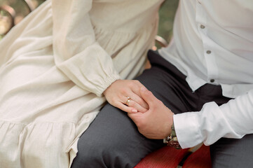 Bride and groom Newlyweds touch hands each other on wedding. A very subtle line trust. Relations between a man and a woman. The concept of love and romantic