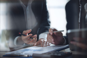 Business team have a discussion on financial report, business analyzing marketing data at office....