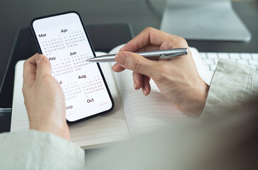 2025 Calendar event planner timetable agenda plan on organize schedule. Business woman using mobile...