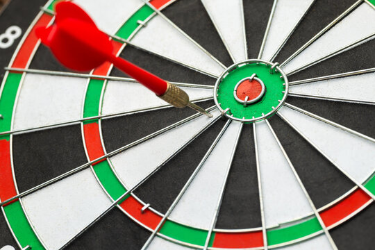 An arrow that missed the center of the target by a short distance, something close to success, almost done, motivation concept, or inaccurate communication