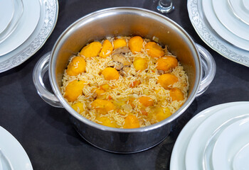 Traditional Brazilian dish chicken with pequi (caryocar brasiliense) and rice