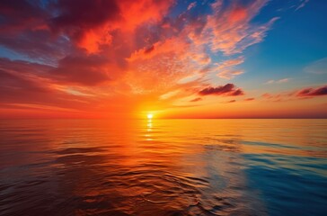 Obraz premium Sunset Over Calm Ocean with Dramatic Sky and Reflected Light