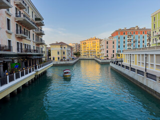 Qanat Quartier on The Pearl Island in Qatar, which is characterized by brightly colored buildings, a lake in the middle, restaurants and shops, is one of the beautiful . Doha Qatar