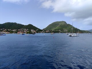 Les Saintes, Terre de Haut seen from the caribbean sea, with catamarans. idyllic west indies...