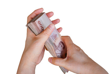hands hold pile of 1000 Baht Thai banknotes ,selective focus represent the wealth concept of thai economy