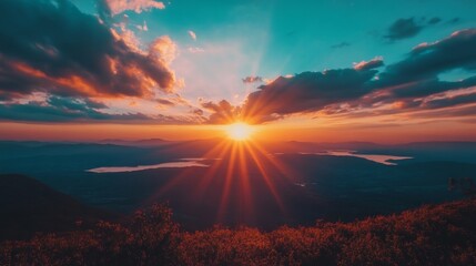 Obraz premium Sunset Over Mountain Valley With Dramatic Rays