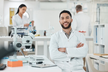 Fototapeta premium Research, portrait and man in laboratory with confidence, smile and medical science innovation. Healthcare, happy and scientist at desk with arms crossed, study or pride in pharmaceutical engineering