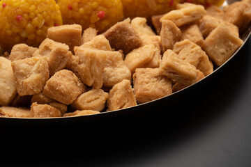 Indian sweets in a plate includes anarsa, shakkarpara morichoor  Bundi Laddu, Gujiya or Karanji for diwali celebration