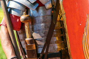 detail of the metal plate armor called lorica segmentata of a roman legionary at a historical reenactment party