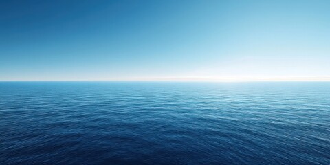 Obraz premium Serene ocean view with clear blue sky and gentle waves.