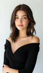 Woman with brown hair wearing a black dress.