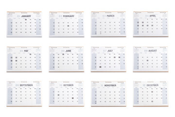 Fototapeta premium A 2025 desk calendar displaying all 12 months, set against a white background. The image symbolizes planning and organization for the year ahead, emphasizing time management and future goals