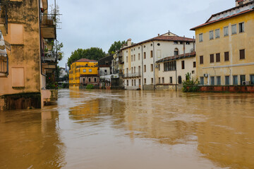 Homes and buildings are almost completely flooded due to a river overflowing during a flood caused by torrential rains