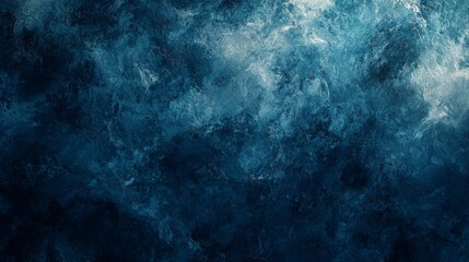 Obraz premium A deep blue abstract texture, resembling waves or clouds, creates a serene and atmospheric background, evoking calmness and depth.