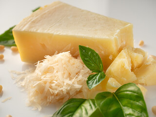 Authentic Italian Parmigiano Reggiano: Aged Cheese Wedge Isolated on White Background